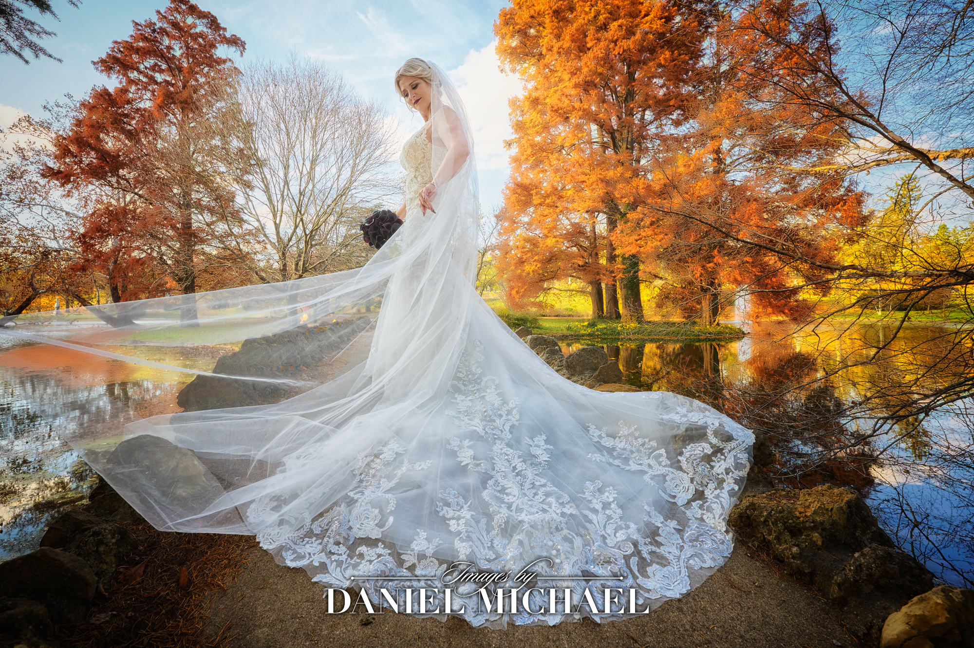 Cincinnati's top wedding photographer captures bride in flowing dress with vivid fall backdrop